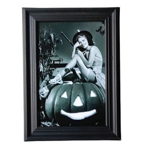 Beautiful woman girl in witch Halloween costume vintage retro pin-up '60s decor